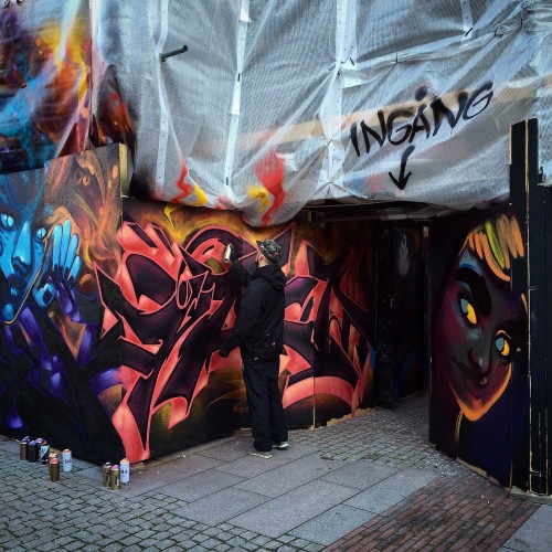 Artist painting the museum entrance