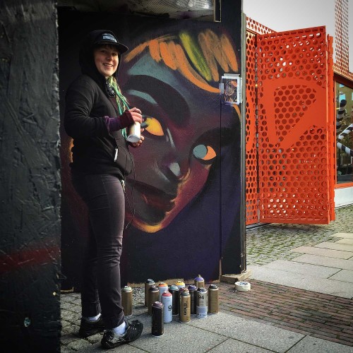 Artist painting the museum entrance