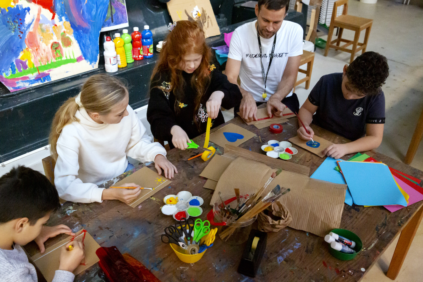 People sitting around a table and creating