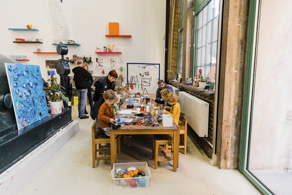 Interior from Verkstan with art educator and children creating