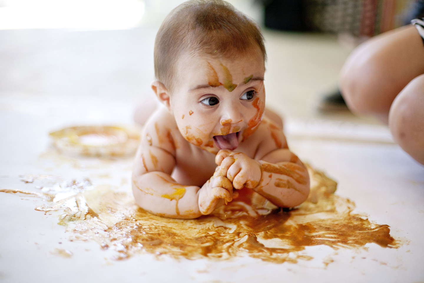 Baby covered with paint.