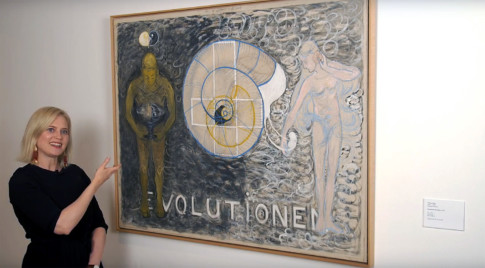 Person in front of Hilma af Klint painting