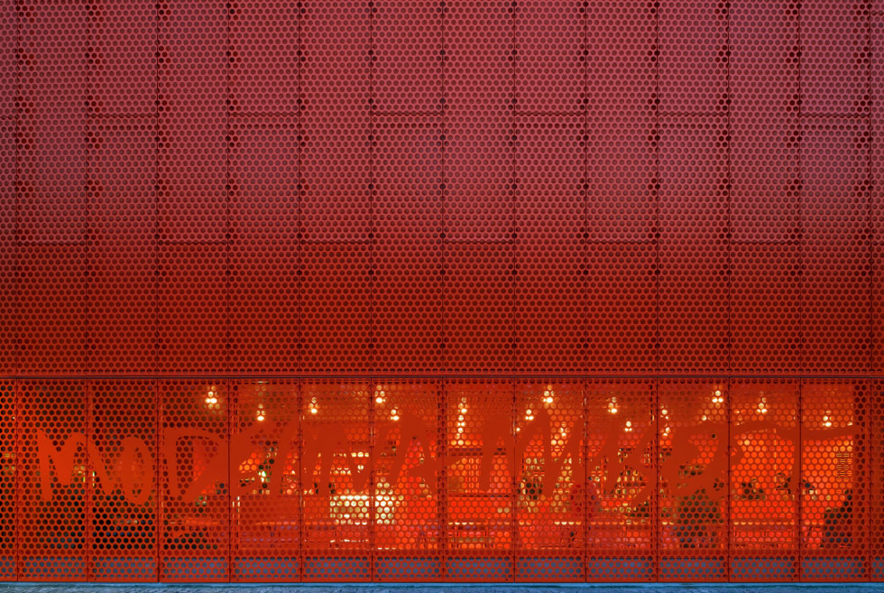 The orange facade of the museum building.