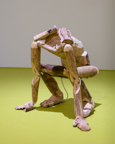 Photo of wooden doll crouching