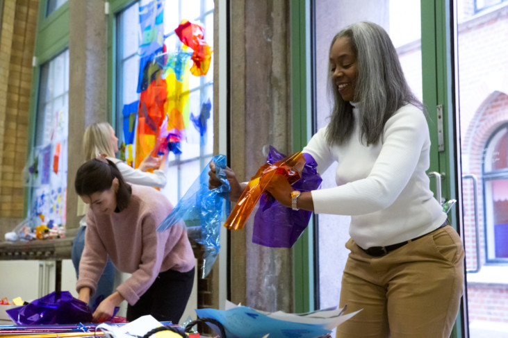 Photo of three persons creating in the museum workshop