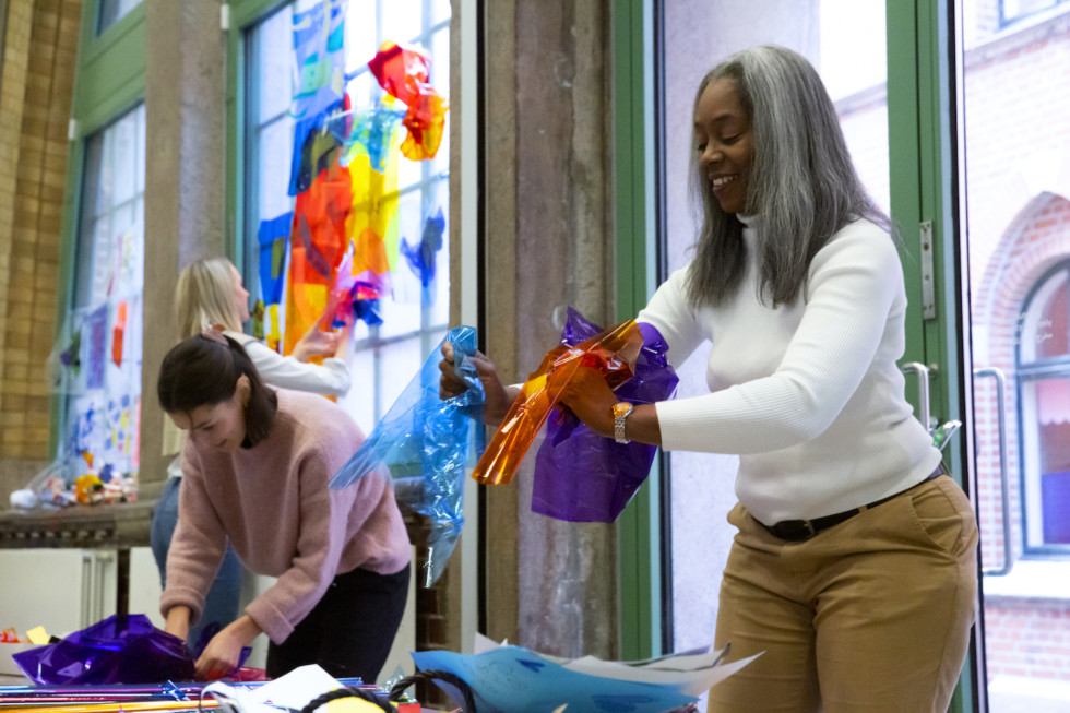 Photo of three persons creating in the museum workshop