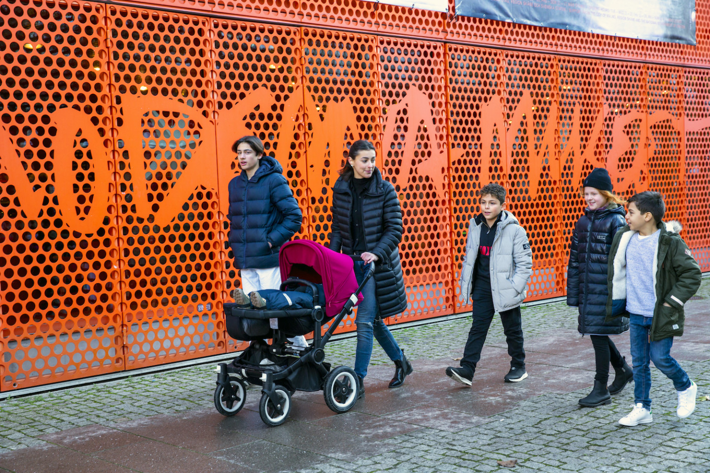 adults and children walking outside Moderna Museet Malmö