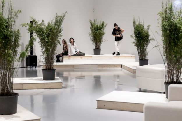 Photo of people and plants in exhibition room