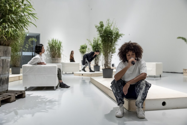 Photo of people and plants in exhibition room