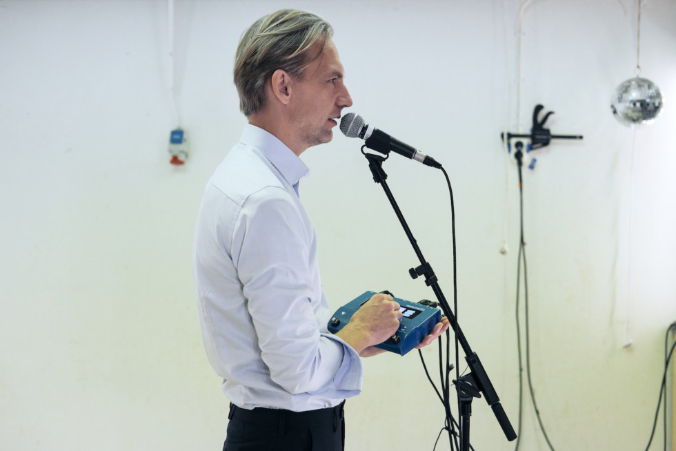 man standing in front of microphone