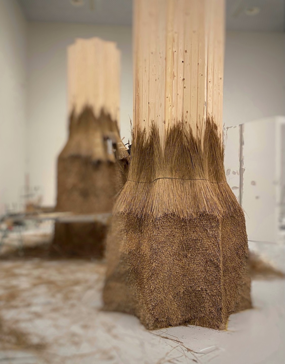 Photo of two straw towers in the making