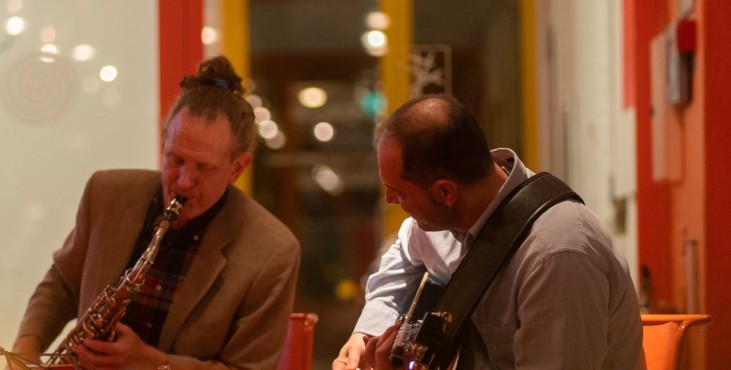 Photo of two musicians playing