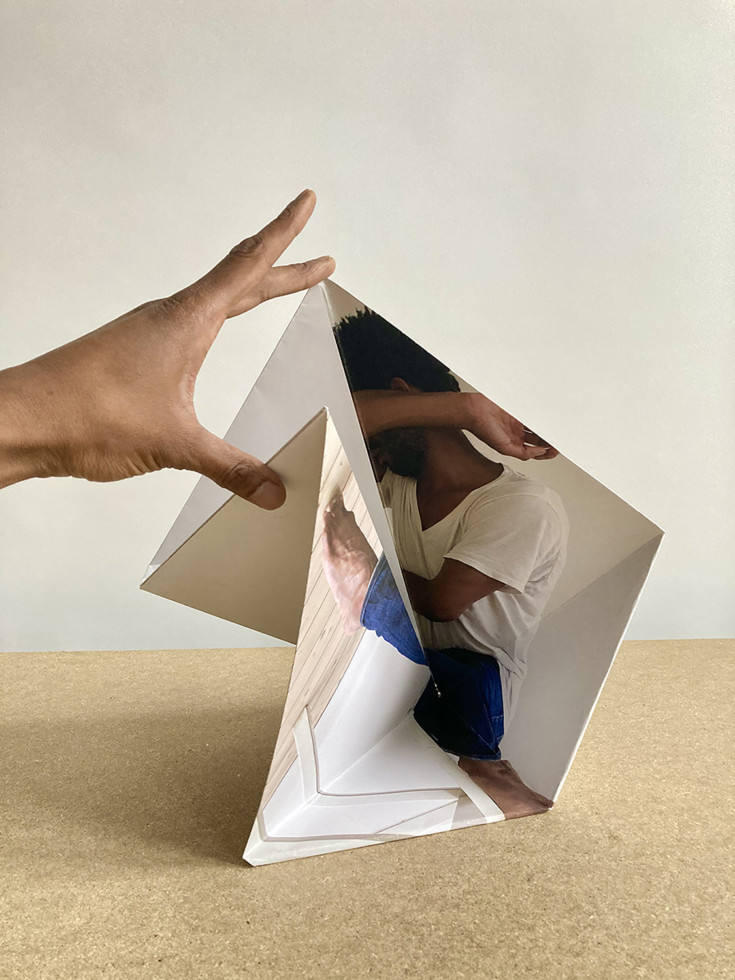 hand holding folded paper
