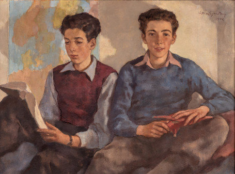 two boys sitting close together 