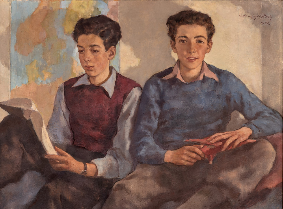 two boys sitting close together