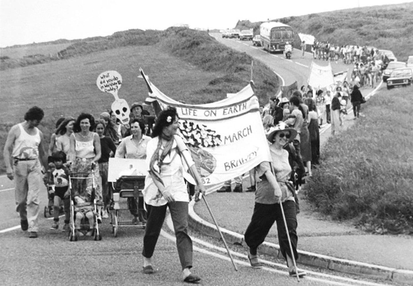 women marching in landscape