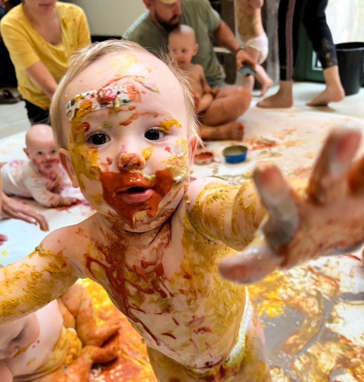 baby covered with paint