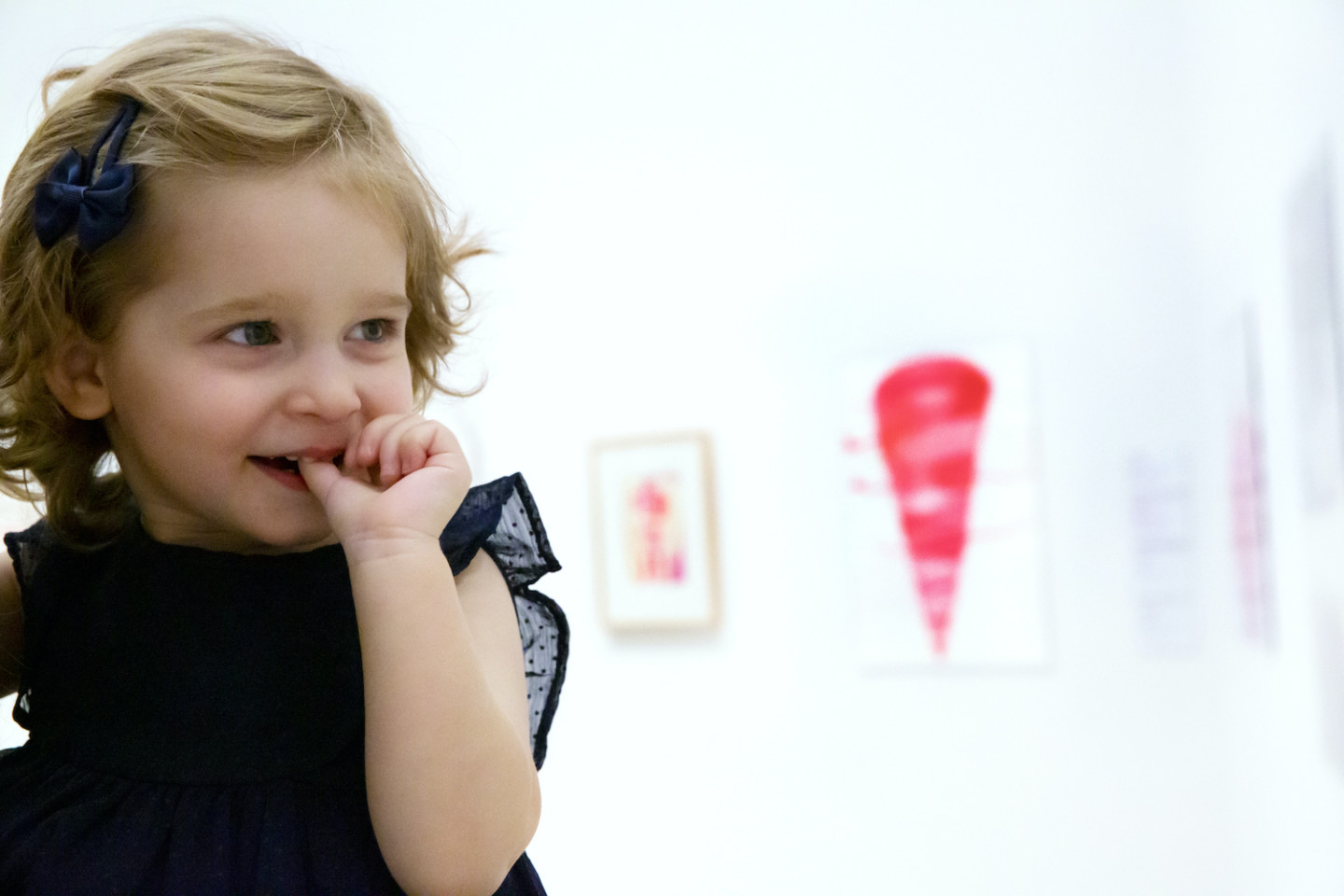 little girl looking at art