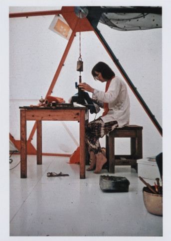 photo of woman working at sewing machine