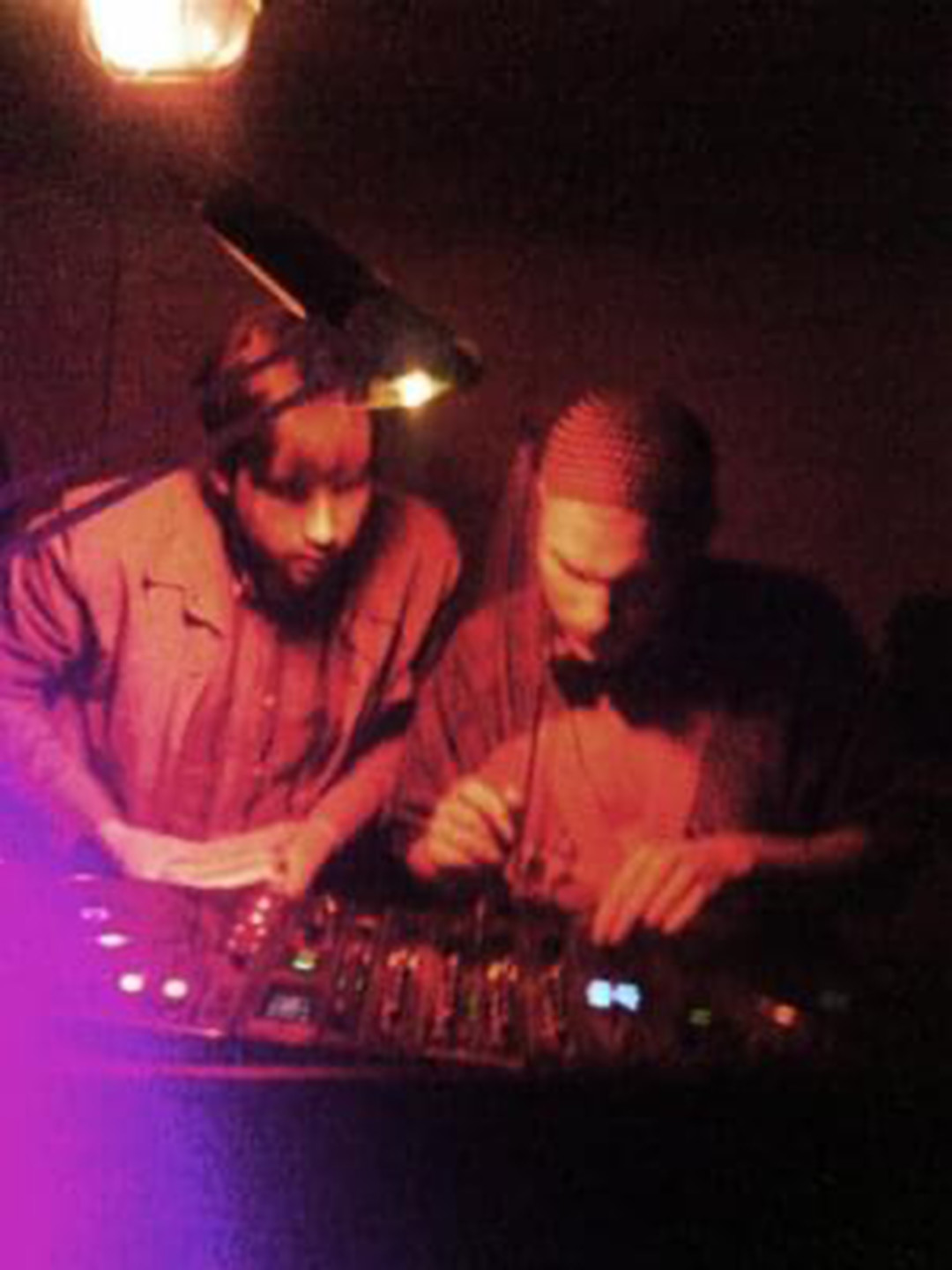 photo of two men DJ-ing