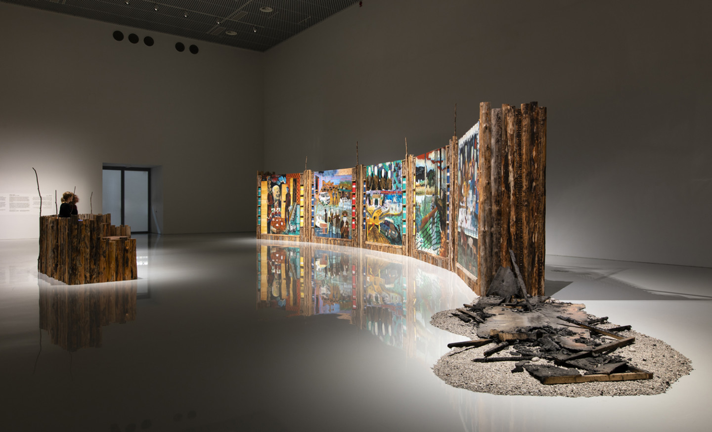 installation view of artwork of wood and paintings