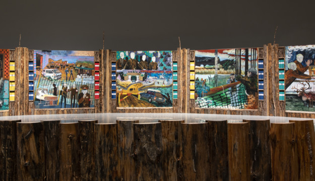 installation with artwork of paintings and wood