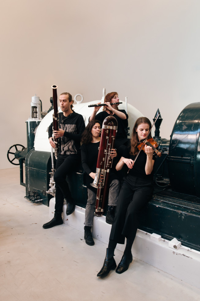 photo of four musicians playing