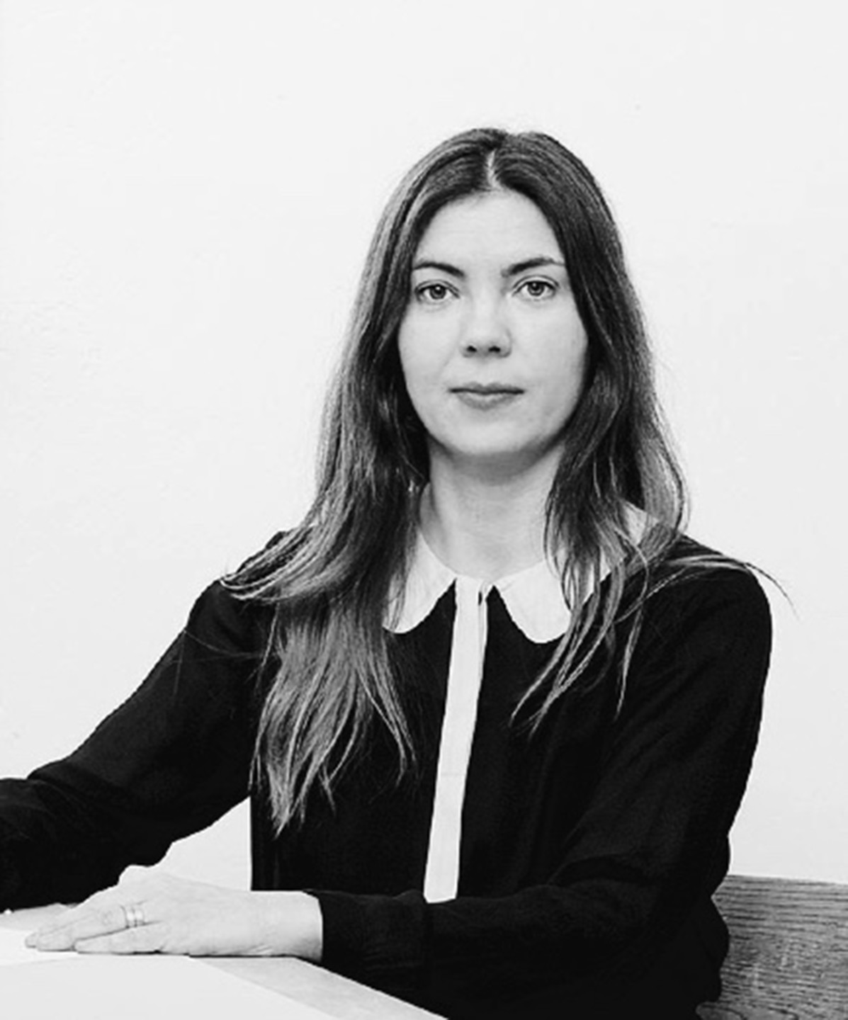 black and white photo of sitting woman