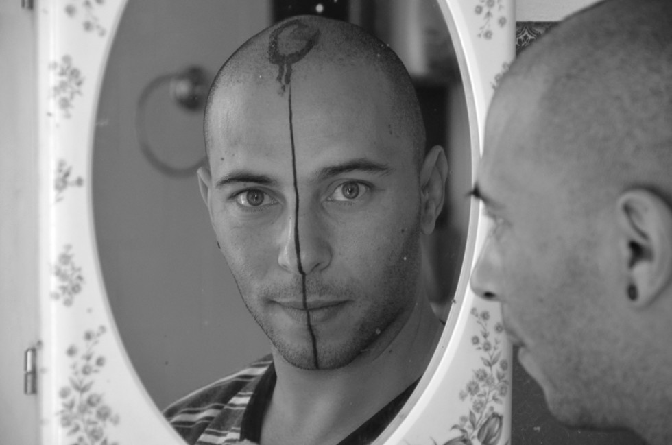 black and white of face in a mirror