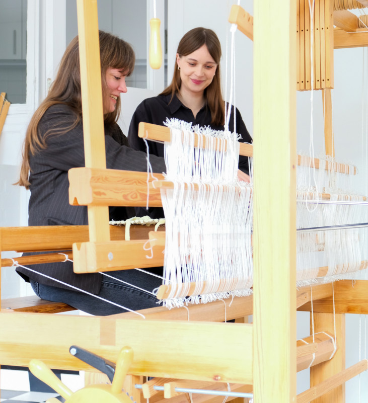 two women at loom