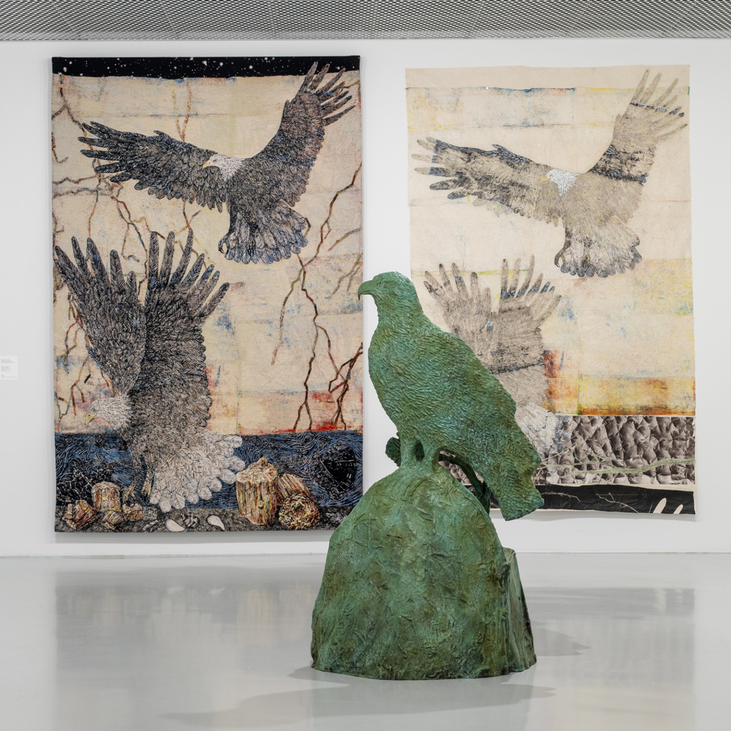 installation view with sculpture and pictures