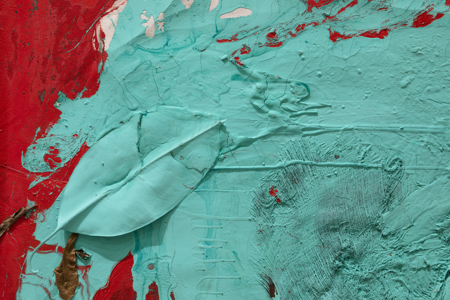 detail of painting in red and green with leaf