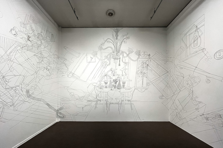 three walls filled with drawings