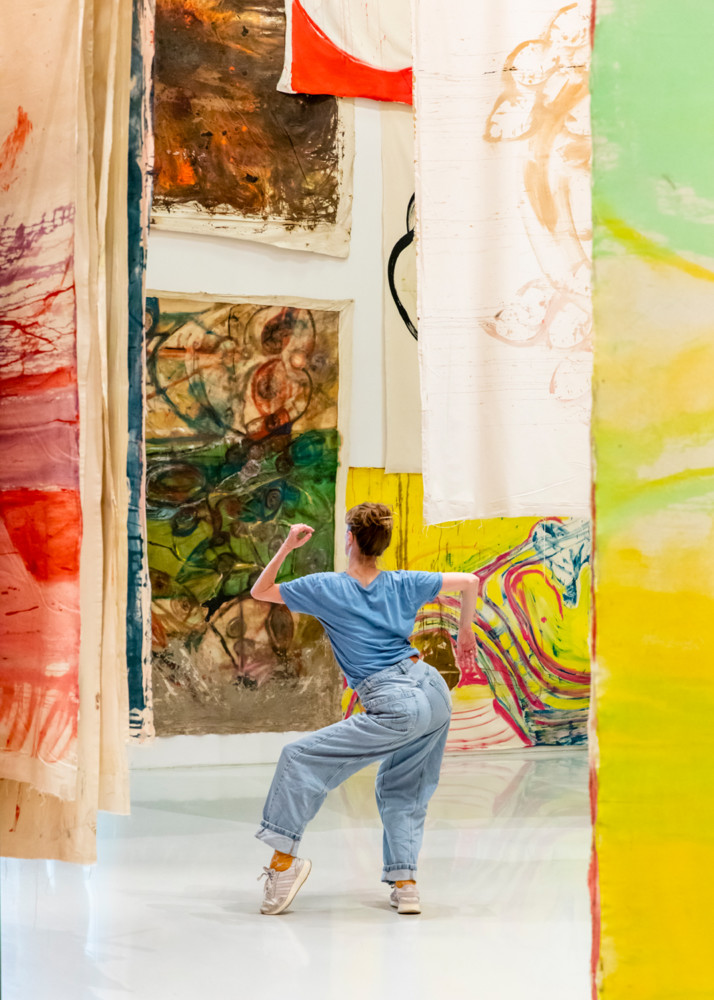 woman dancing in exhibition room
