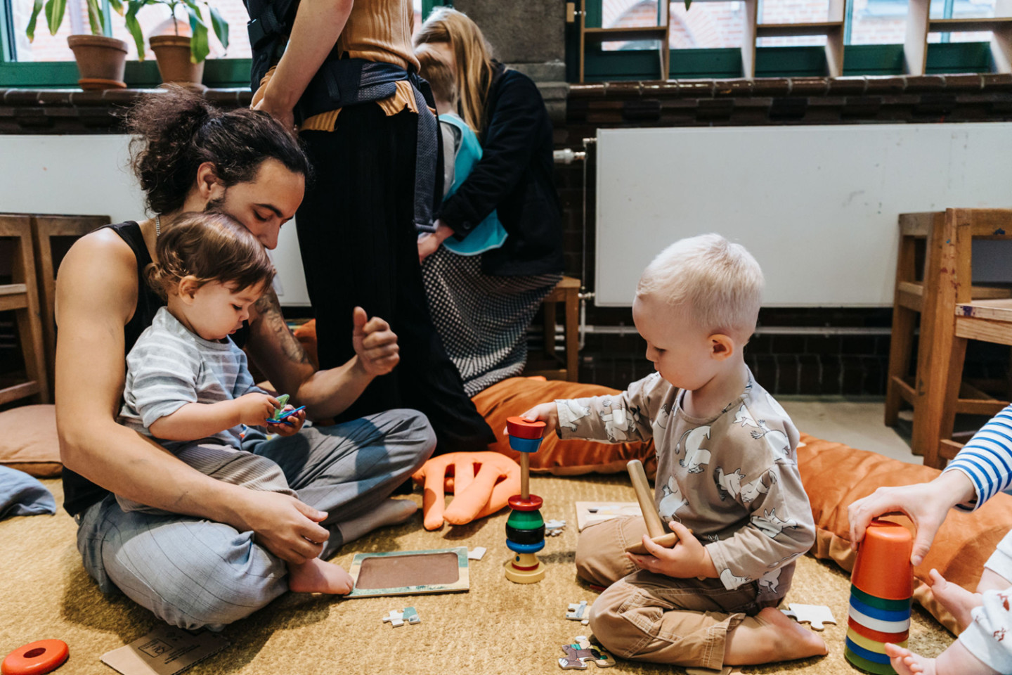 children and adult playing