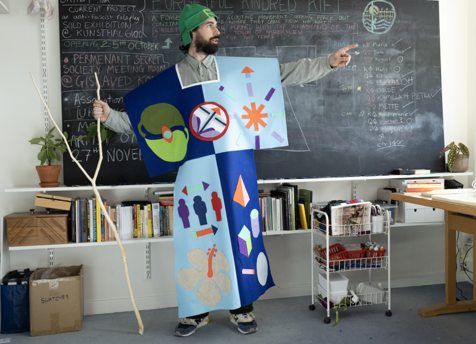 man in funny costume in a classroom