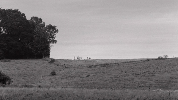 landskap med barn på kulle