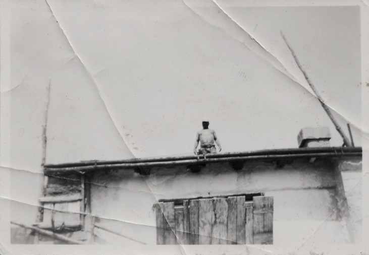 photo of man on roof