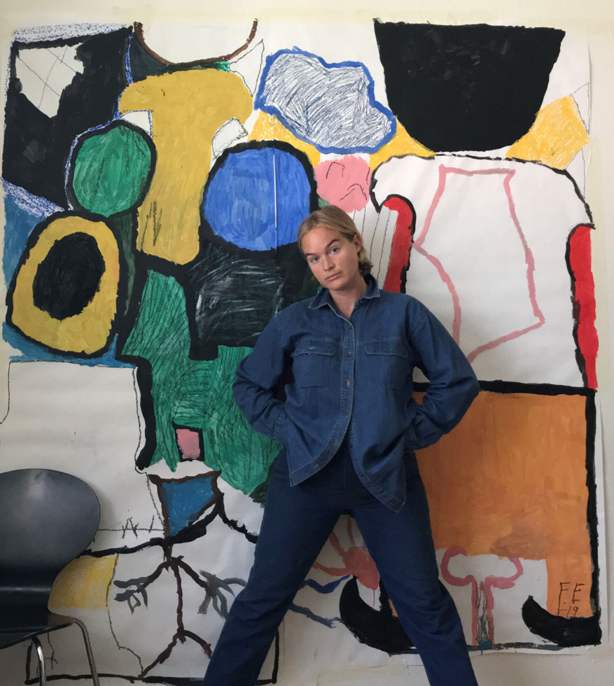 photo of woman in front of painting