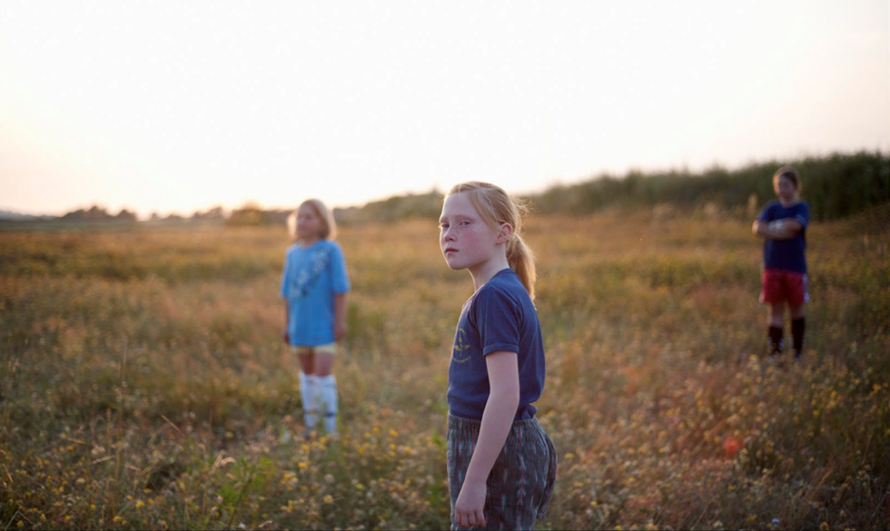 photo of children on field