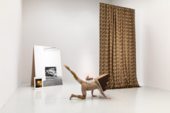 person performing in room with art objects