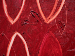 En rödmålad canvas med ovala penseldrag