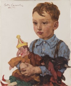 Porträtt av pojke med kasperdocka