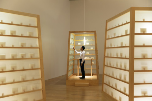 photo of man standing in exhibition