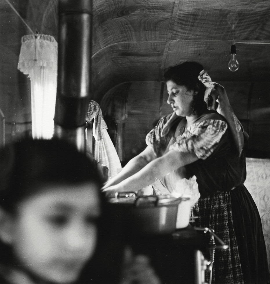 No title. From the series Gipsy Road 1954-55. Stina Taikon cooking for her children in her caravan