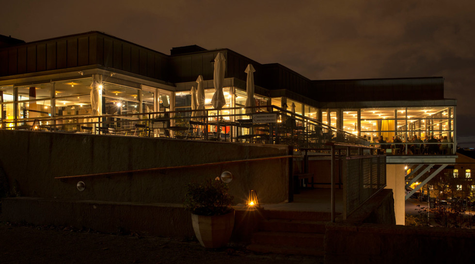 The museum building in the evening with people in the Restaurant