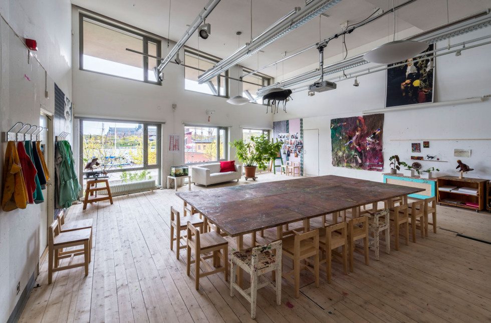 Large bright room, high ceilings with tables and chairs for creation.