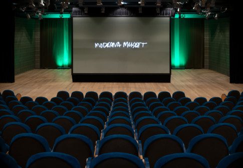 The Auditorium's stage with rows of chairs in the foreground