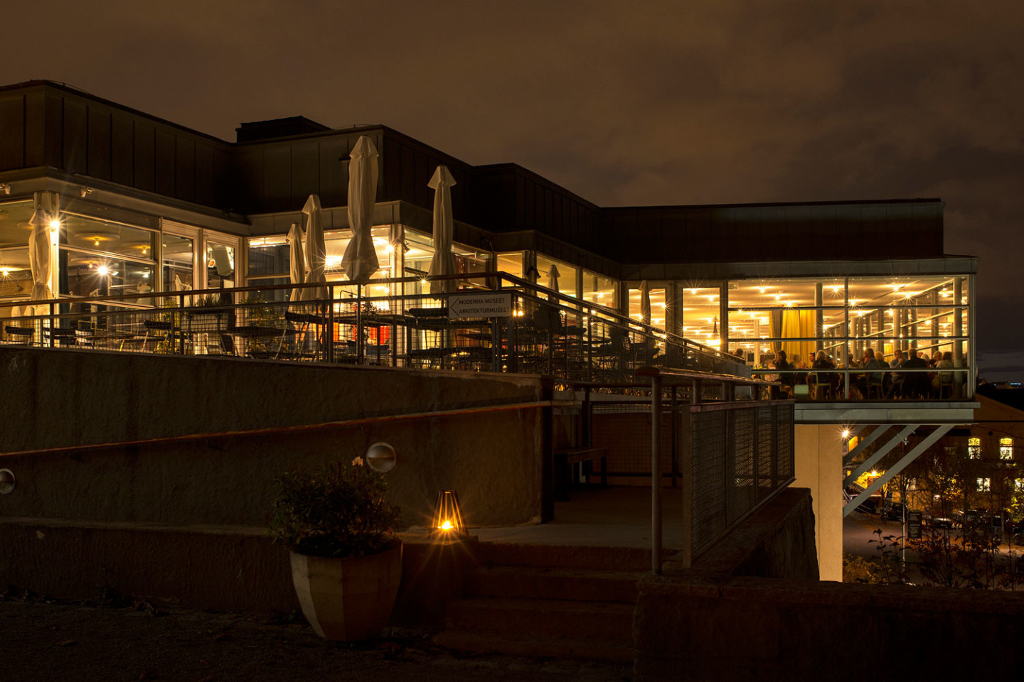 The museum building in the evening with people in the Restaurant