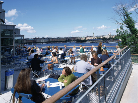 The terrace with people eating and drinking